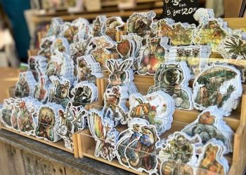 Stickers at the Oregon Country Fair 2026 Poster Artist Booth